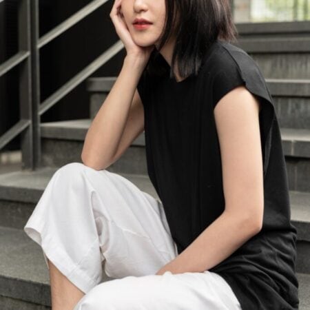 Female model with Oversized Tank Top Black T-shirt.