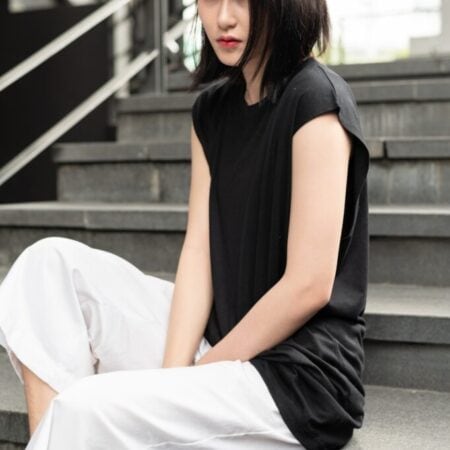 Female model with Oversized Tank Top Black T-shirt.