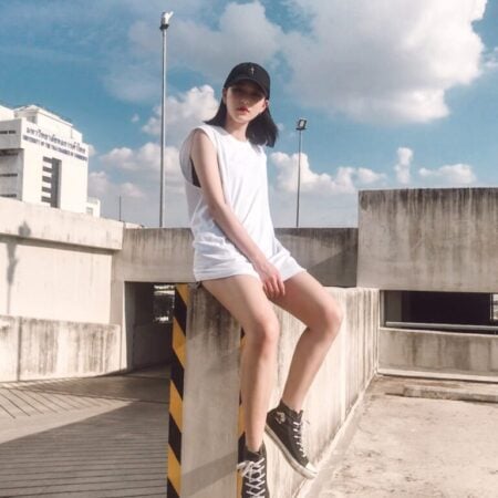 Female model with Oversized Tank Top White T-shirt.