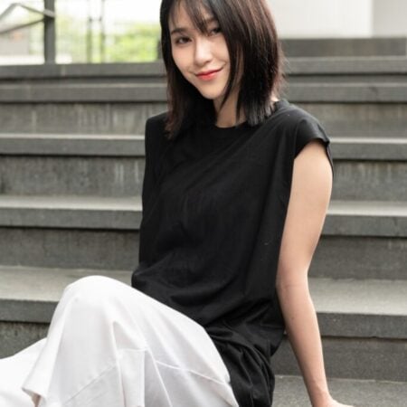 Female model with Oversized Tank Top Black T-shirt.
