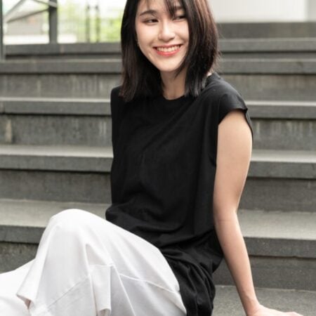 Female model with Oversized Tank Top Black T-shirt.