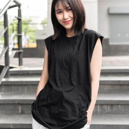 Female model with Oversized Tank Top Black T-shirt.