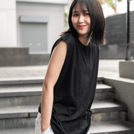 Female model with Oversized Tank Top Black T-shirt.