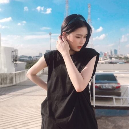 Female model with Oversized Tank Top Black T-shirt.