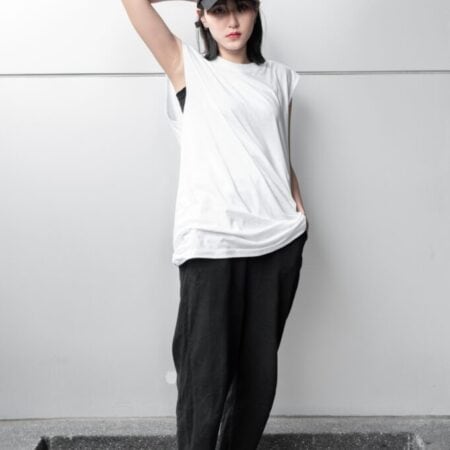 Female model with Oversized Tank Top White T-shirt.