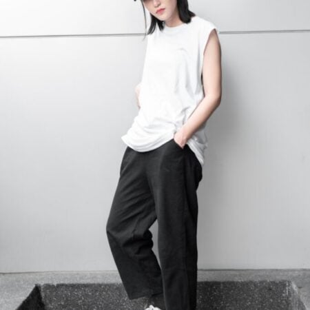 Female model with Oversized Tank Top White T-shirt.