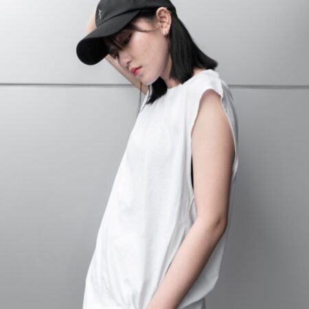 Female model with Oversized Tank Top White T-shirt.