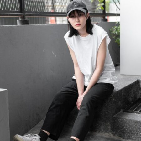 Female model with Oversized Tank Top White T-shirt.