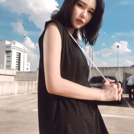 Female model with Oversized Tank Top Black T-shirt.