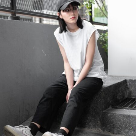 Female model with Oversized Tank Top White T-shirt.