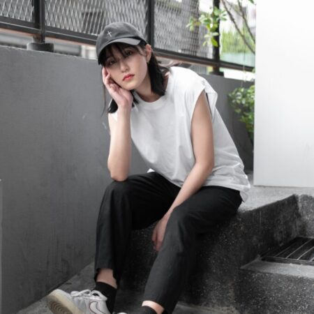 Female model with Oversized Tank Top White T-shirt.