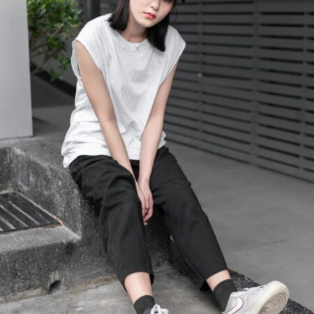 Female model with Oversized Tank Top White T-shirt.