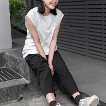 Female model with Oversized Tank Top White T-shirt.