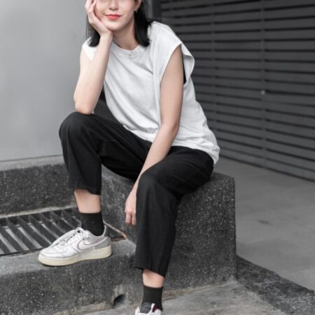 Female model with Oversized Tank Top White T-shirt.