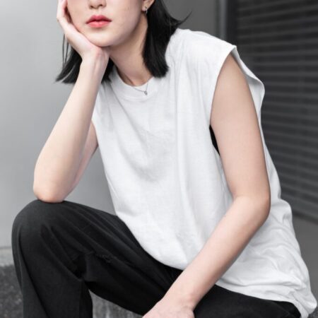 Female model with Oversized Tank Top White T-shirt.