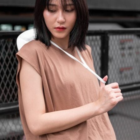 Female model with Oversized Tank Top Light Chocolate T-shirt.