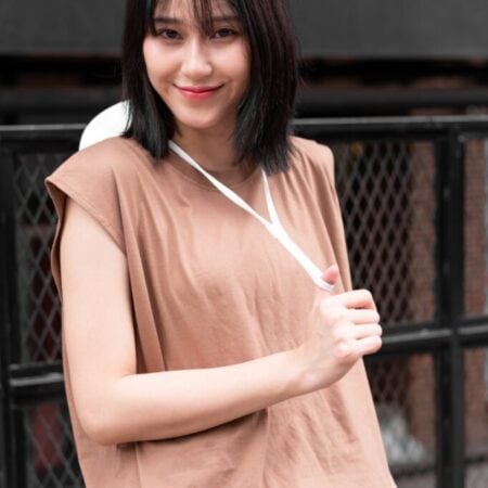 Female model with Oversized Tank Top Light Chocolate T-shirt.