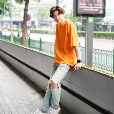 Men model with Oversized Pumpkin Orange T-shirt.