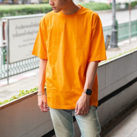 Men model with Oversized Pumpkin Orange T-shirt.